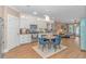 Bright open kitchen with white cabinetry, stainless appliances, and a cozy dining area under recessed lighting at 460 Boundary Ave. # A & B, Murrells Inlet, SC 29576