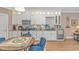 Bright kitchen boasts white cabinetry, modern appliances, and a charming breakfast nook at 460 Boundary Ave. # A & B, Murrells Inlet, SC 29576