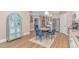 Open kitchen and dining area with elegant blue accents, modern appliances, and ample cabinet space at 460 Boundary Ave. # A & B, Murrells Inlet, SC 29576