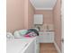 Convenient laundry room with washer, dryer, sink, and ample storage space at 460 Boundary Ave. # A & B, Murrells Inlet, SC 29576