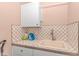 Practical laundry area with utility sink, cabinet, and attractive tile backsplash at 460 Boundary Ave. # A & B, Murrells Inlet, SC 29576