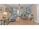 Cozy living room with hardwood floors, ceiling fan, and a stylish entertainment center at 460 Boundary Ave. # A & B, Murrells Inlet, SC 29576