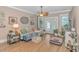 Bright living room featuring hardwood floors, a ceiling fan, and comfortable seating at 460 Boundary Ave. # A & B, Murrells Inlet, SC 29576