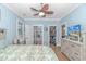 Bright main bedroom with a ceiling fan, walk-in closet, and ensuite bathroom at 460 Boundary Ave. # A & B, Murrells Inlet, SC 29576