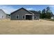 New construction home backyard awaiting landscaping; features covered patio and ample space at 4762 Huckleberry Ln., Conway, SC 29526