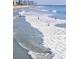 Beautiful beach scene with gentle waves and a pier in the distance at 4762 Huckleberry Ln., Conway, SC 29526