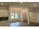 Inviting dining room with modern chandelier, wood floors, and views to the outdoors at 4762 Huckleberry Ln., Conway, SC 29526