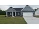 Charming single-Gathering home features a two-car garage, manicured lawn, and classic architectural details at 4762 Huckleberry Ln., Conway, SC 29526