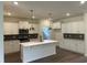 Modern kitchen features white cabinetry, stainless steel appliances, and a sleek island at 4762 Huckleberry Ln., Conway, SC 29526
