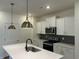 Kitchen boasts a large island, pendant lighting, and modern appliances at 4762 Huckleberry Ln., Conway, SC 29526