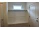 Bright mudroom with built-in bench, coat hooks, shelving, and a window for natural light at 4762 Huckleberry Ln., Conway, SC 29526
