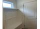 Well-lit mudroom with bench seating, a window, and a sturdy door to the exterior at 4762 Huckleberry Ln., Conway, SC 29526