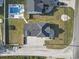 Aerial view of the property, showcasing the layout, backyard, pool, and proximity to surrounding neighborhood at 4862 Mill Pond Rd., Myrtle Beach, SC 29588