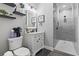 Updated bathroom with walk-in shower, modern fixtures, and vanity with sink at 4862 Mill Pond Rd., Myrtle Beach, SC 29588