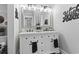 Bright bathroom featuring a double sink vanity with a marble countertop and modern fixtures at 4862 Mill Pond Rd., Myrtle Beach, SC 29588