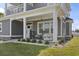 Inviting front porch featuring rocking chairs and swing creating a cozy outdoor space at 4862 Mill Pond Rd., Myrtle Beach, SC 29588