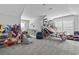 Spacious playroom with basketball hoops, seating, and organized storage at 4862 Mill Pond Rd., Myrtle Beach, SC 29588