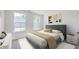 Cozy bedroom with natural light and views, featuring modern decor and carpeted floors at 492 Sun Colony Blvd., Longs, SC 29568