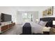 Comfortable bedroom with a large window, dresser, soft lighting, and serene ambiance at 492 Sun Colony Blvd., Longs, SC 29568