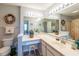 Bright bathroom vanity features decorative accents and a large mirror for a spa-like feel at 5000 Windsor Green Way # 102, Myrtle Beach, SC 29579