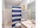 Bright bathroom featuring a shower-tub combo and a white vanity sink at 5000 Windsor Green Way # 102, Myrtle Beach, SC 29579