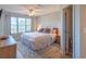 Bright bedroom features large window, ceiling fan and a plush rug at 5000 Windsor Green Way # 102, Myrtle Beach, SC 29579