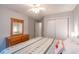 Well-lit bedroom features a bed, dresser, and closet, offering a relaxing atmosphere with ample storage at 5000 Windsor Green Way # 102, Myrtle Beach, SC 29579