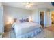 Bright and airy bedroom featuring a ceiling fan, closet, and neutral paint at 5000 Windsor Green Way # 102, Myrtle Beach, SC 29579