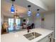 Open-concept kitchen with bar seating offering views of the dining and living room areas at 5000 Windsor Green Way # 102, Myrtle Beach, SC 29579