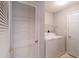 Clean laundry room equipped with a white washer and dryer set and white storage space at 5000 Windsor Green Way # 102, Myrtle Beach, SC 29579