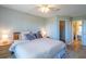 Relaxing primary bedroom featuring plush bedding, neutral decor, and access to an ensuite bathroom at 5000 Windsor Green Way # 102, Myrtle Beach, SC 29579