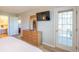 The primary bedroom includes closet access and a door that leads to the outside at 5000 Windsor Green Way # 102, Myrtle Beach, SC 29579