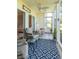 Relaxing screened porch with comfortable seating and views of the outdoors at 5000 Windsor Green Way # 102, Myrtle Beach, SC 29579