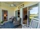Comfortable screened porch with ceiling fan, rocking chair and comfortable seating with outdoor views at 5000 Windsor Green Way # 102, Myrtle Beach, SC 29579