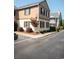 Charming townhome featuring black shutters, manicured landscaping, and a welcoming curb appeal at 501 44Th Ave. N # D 9, Myrtle Beach, SC 29577