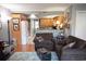 Comfortable living room featuring hardwood floors, a cozy sofa, and an open view of the kitchen at 501 44Th Ave. N # D 9, Myrtle Beach, SC 29577
