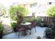 Charming patio with a table and chairs, surrounded by lush greenery and offering a serene outdoor space at 501 44Th Ave. N # D 9, Myrtle Beach, SC 29577
