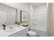 Clean bathroom featuring a vanity, toilet, and shower-tub combination with neutral colors and functional design at 509 Blissful Ln., Little River, SC 29566