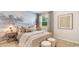 Comfortable bedroom featuring decorative wallpaper, and natural lighting at 509 Blissful Ln., Little River, SC 29566