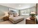 Calming bedroom with a large comfortable bed, stylish lamps, and a peaceful ambiance at 509 Blissful Ln., Little River, SC 29566