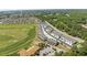 Scenic aerial view of townhomes with a golf course and clubhouse in a residential community at 5111 Double Eagle Way # 3, North Myrtle Beach, SC 29582