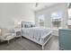 Bright bedroom featuring a cozy chair, wood-look flooring, and lots of natural light at 5111 Double Eagle Way # 3, North Myrtle Beach, SC 29582