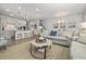 Open concept living space with dining area, comfortable sofas, and a modern kitchen at 5111 Double Eagle Way # 3, North Myrtle Beach, SC 29582