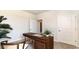 Office featuring a wooden desk, carpeted floor, and two doors at 519 Blissful Ln., Little River, SC 29566