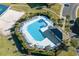 Aerial view showcasing pool with lounge chairs and nearby clubhouse at 5801 Oyster Catcher Dr. # 1214, North Myrtle Beach, SC 29582