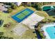 Aerial shot showcasing a tennis court, volleyball court, and swimming pool at 5801 Oyster Catcher Dr. # 1214, North Myrtle Beach, SC 29582