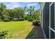 Expansive backyard with lush green grass and mature trees, perfect for outdoor activities and relaxation at 5801 Oyster Catcher Dr. # 1214, North Myrtle Beach, SC 29582