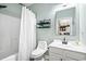 Well-lit bathroom with a shower, sleek vanity, and modern shelving for storage and organization at 5801 Oyster Catcher Dr. # 1214, North Myrtle Beach, SC 29582