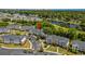 Exterior view of condo buildings with balconies, parking area, and green landscaping at 5801 Oyster Catcher Dr. # 1214, North Myrtle Beach, SC 29582