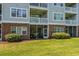 Condominium featuring a ground-level screened porch that looks out on a green lawn at 5801 Oyster Catcher Dr. # 1214, North Myrtle Beach, SC 29582
